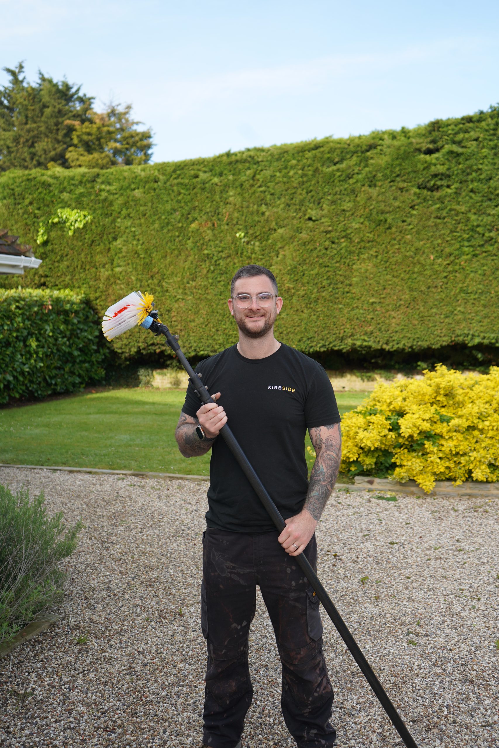 Residential window cleaner cleaning the windows of a home in Benfleet.