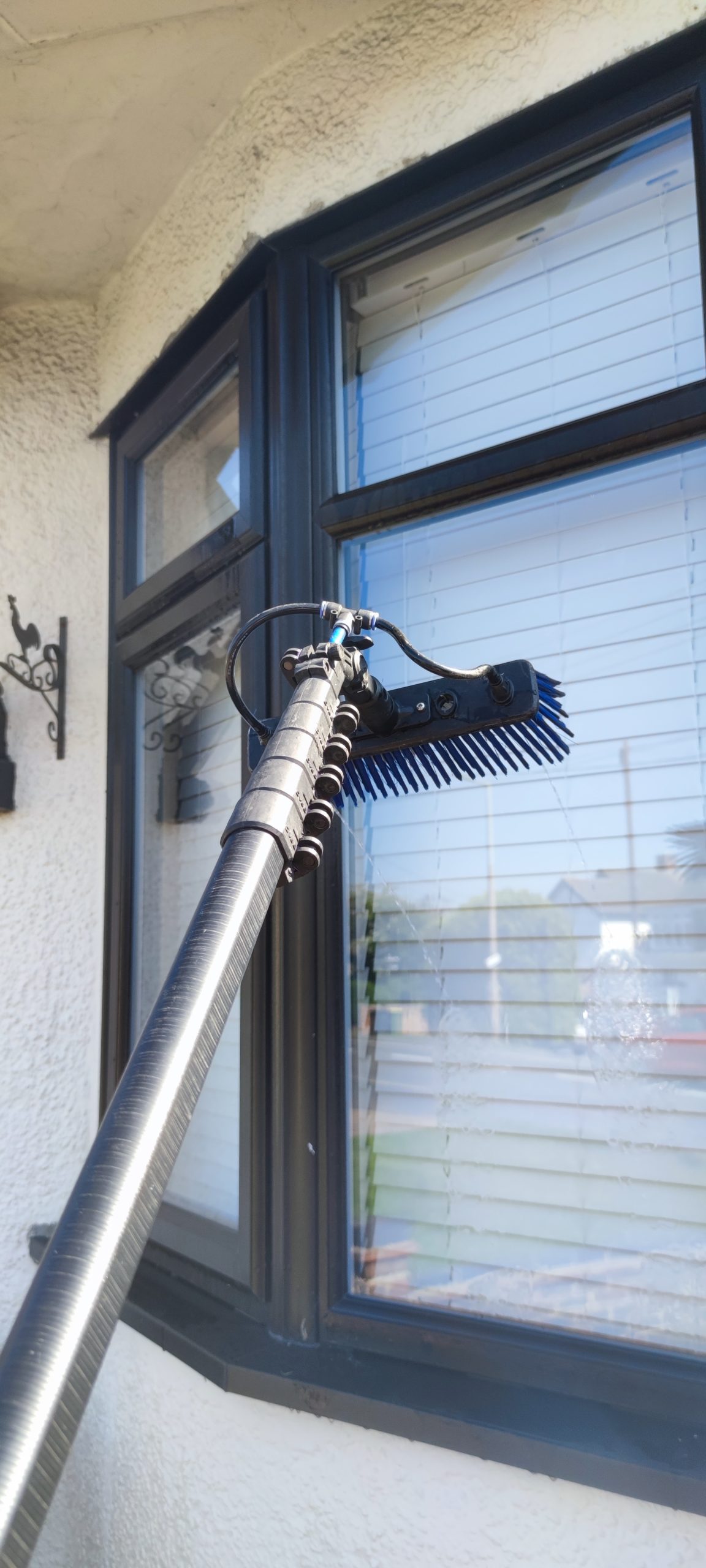 window cleaning a window in Hockley, Essex